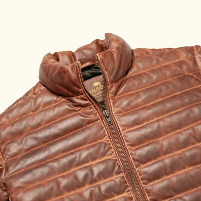 Authentic Buffalo Jackson Bridger Leather Down Jacket close-up showing real down fill and antique brass YKK zipper hardware