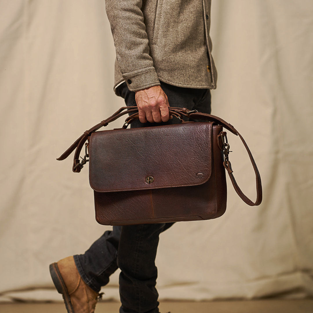 Roosevelt Leather Laptop Messenger Bag in Buffalo Grain — full-grain leather flap with antique brass turn-lock closure and adjustable strap